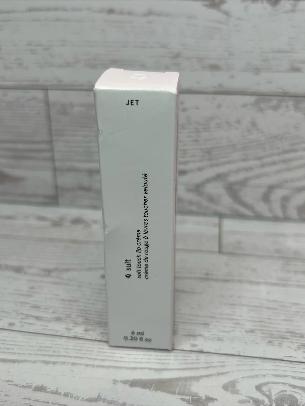 Glossier G suit, soft touch lip cream, shade JET